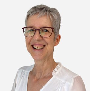 Fiona Catham, Human Resources Manager, with short grey hair, smiling with a white shirt.