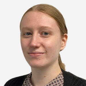 Catherine Willis, Software Engineer, with long blonde hair, smiling in a black jacket.