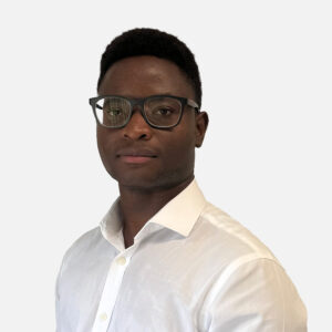 Obriel Mariga, Software Engineer, with short, dark brown hair and glasses, smiling in a white shirt.