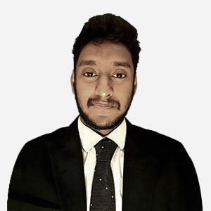 Janitha Gamage, Software Engineer, with short brown hair, smiling in a black jacket.