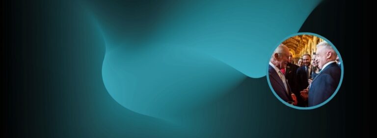 Banner showing king charles and managing director after winning kings award